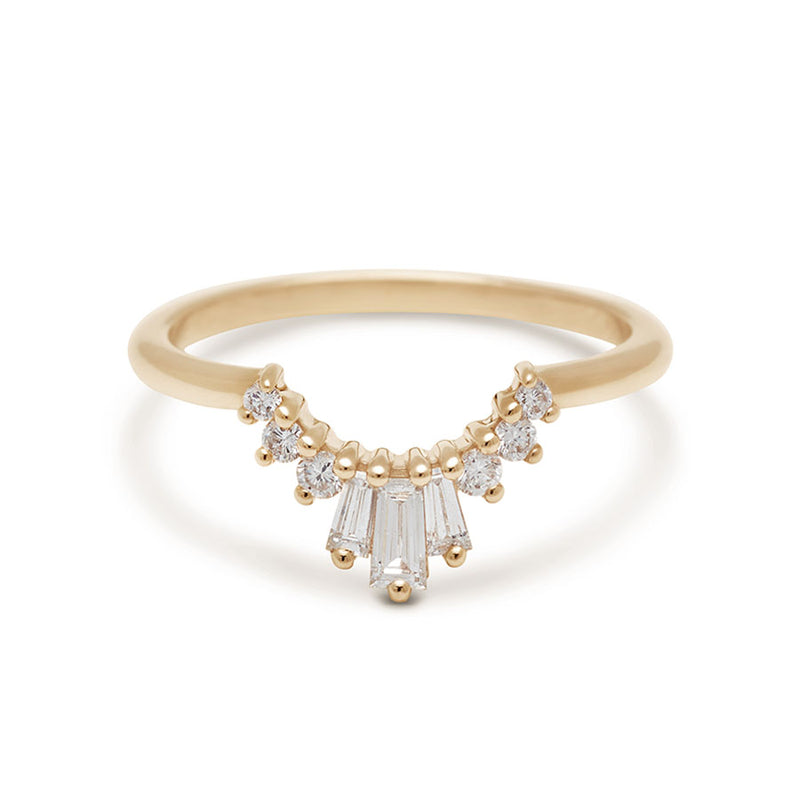 A three white diamond baguette band with three round white diamonds on either side set in yellow gold., Yellow Gold