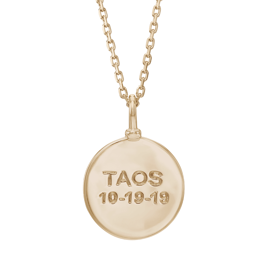 A 18mm plain gold charm set in yellow gold on a yellow gold chain with "TAOS 10-19-19" engraved on., 18mm