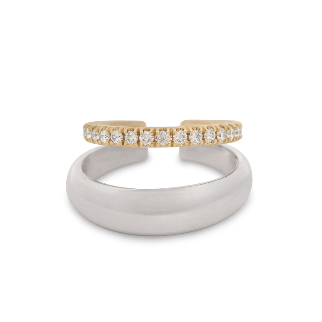 A double hoop earring cuff featuring a sterling silver hoop and a yellow gold hoop with white diamonds on a white background