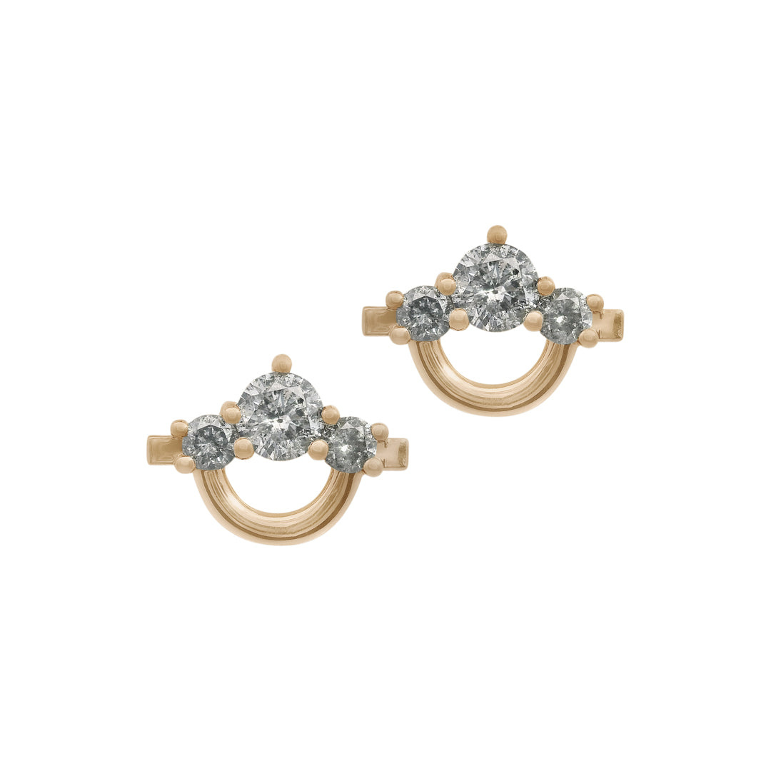 Pair of gold and grey diamond earrings on a white background