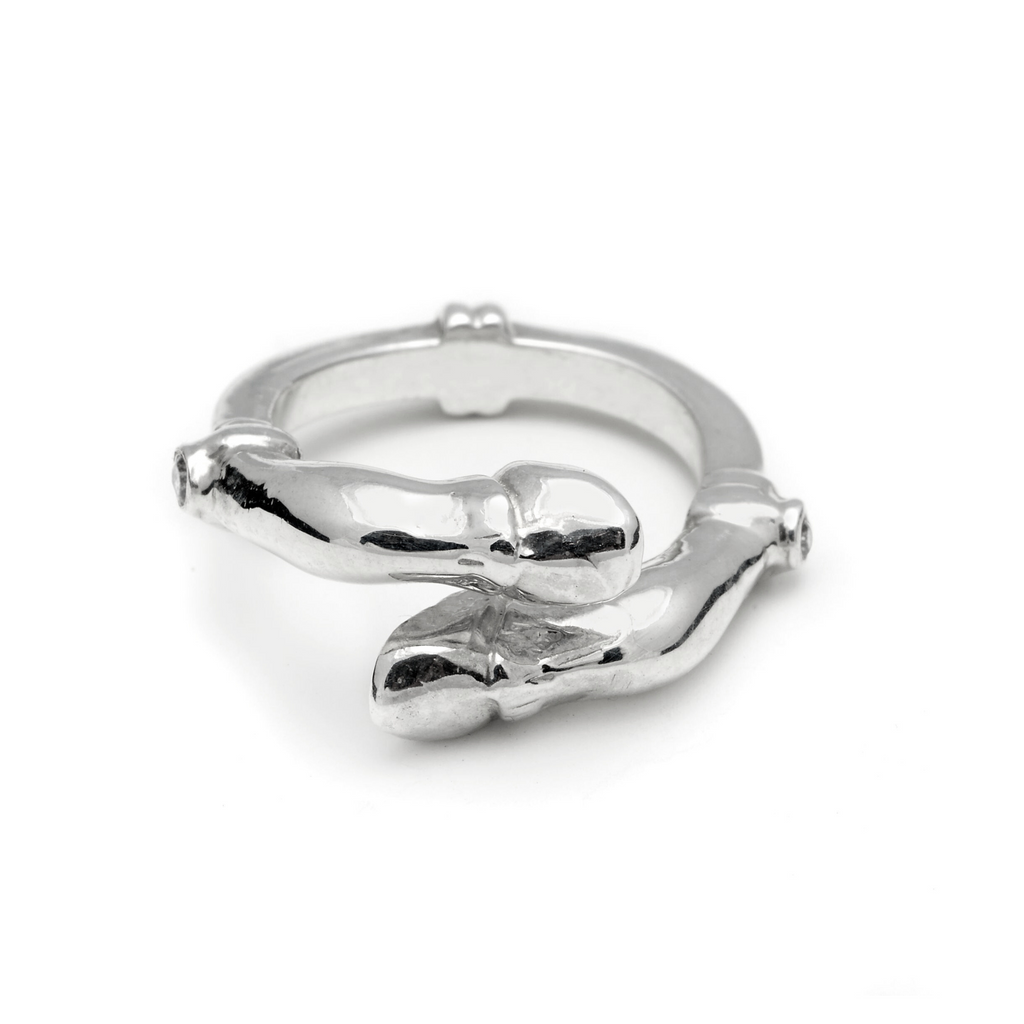 Silver ring with two horse hooves on a white background