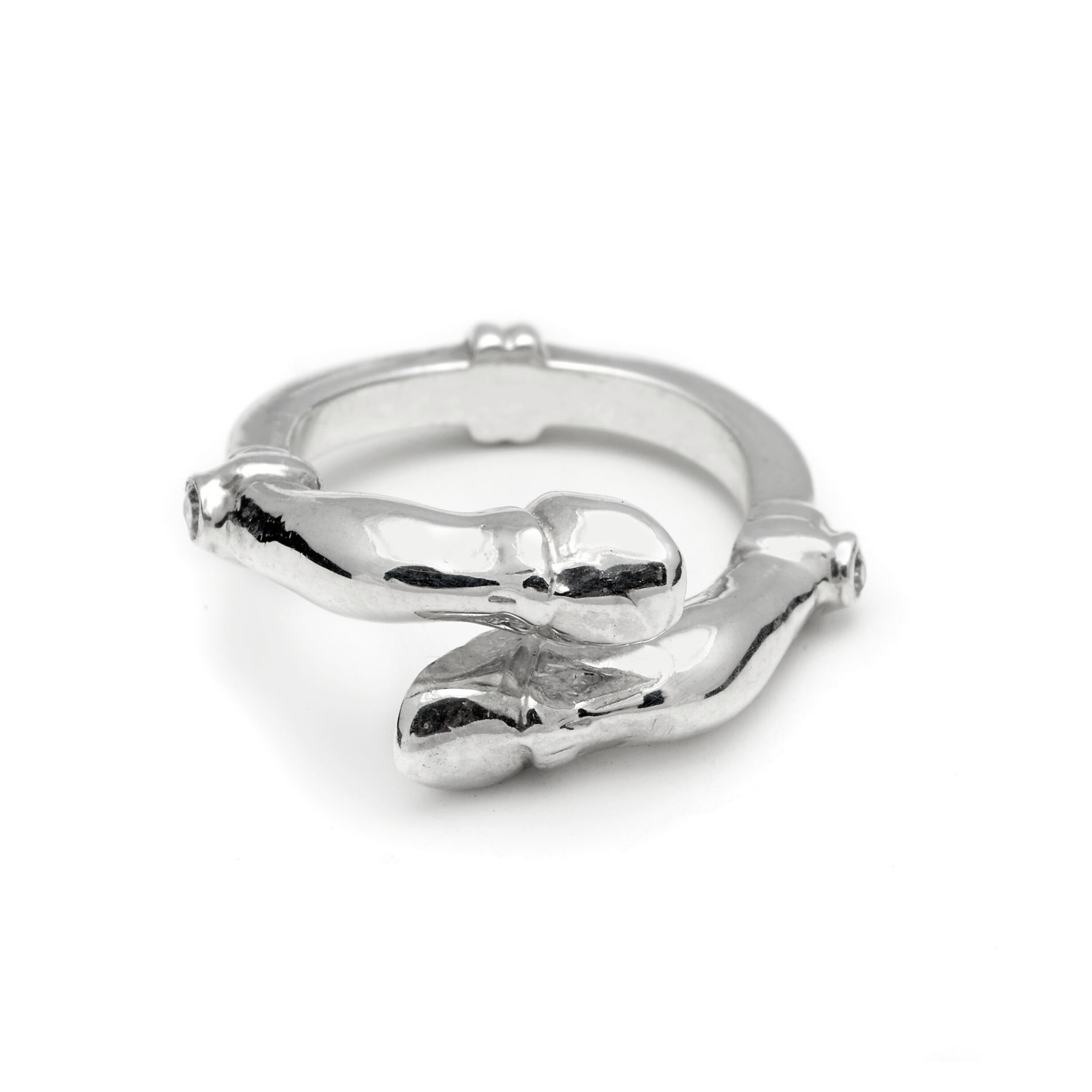 Silver ring with two horse hooves on a white background