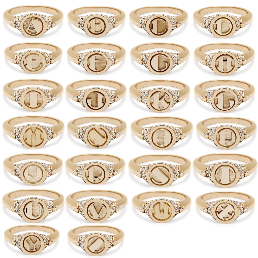 All 26 letter versions on monogrammed signet rings set in yellow gold with white diamond pave.