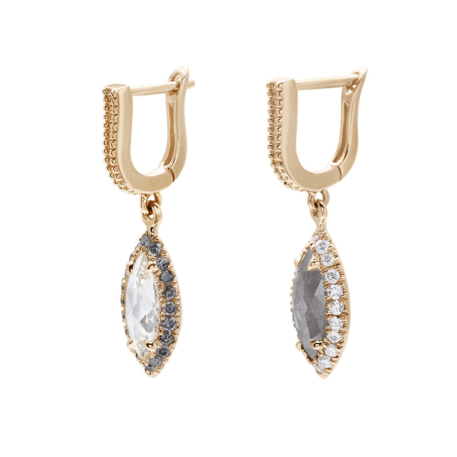 A pair of drop earrings where both earrings are angled with a U shaped hoop. One earring has white diamond pave and a marquise shaped grey diamond, the other has grey diamond pave and a marquise shaped white diamond set in yellow gold.
