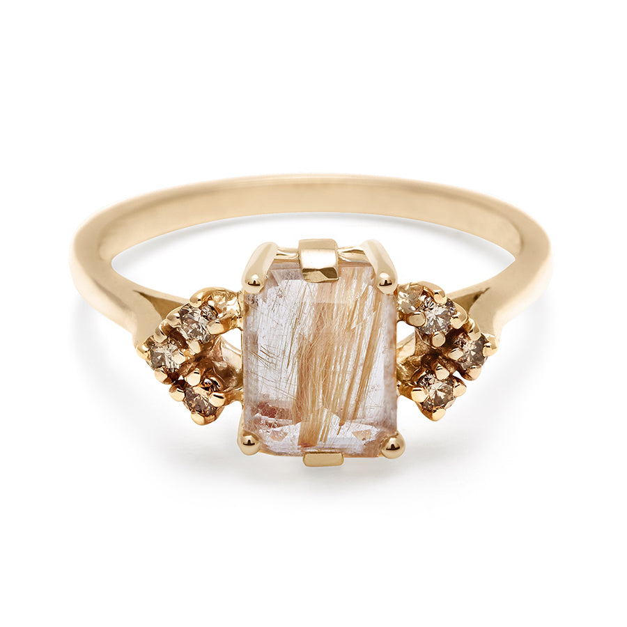 A ring with an emerald cut golden rutilated quartz center with three round champagne diamonds on either side in arrow shape, set in yellow gold., Yellow Gold