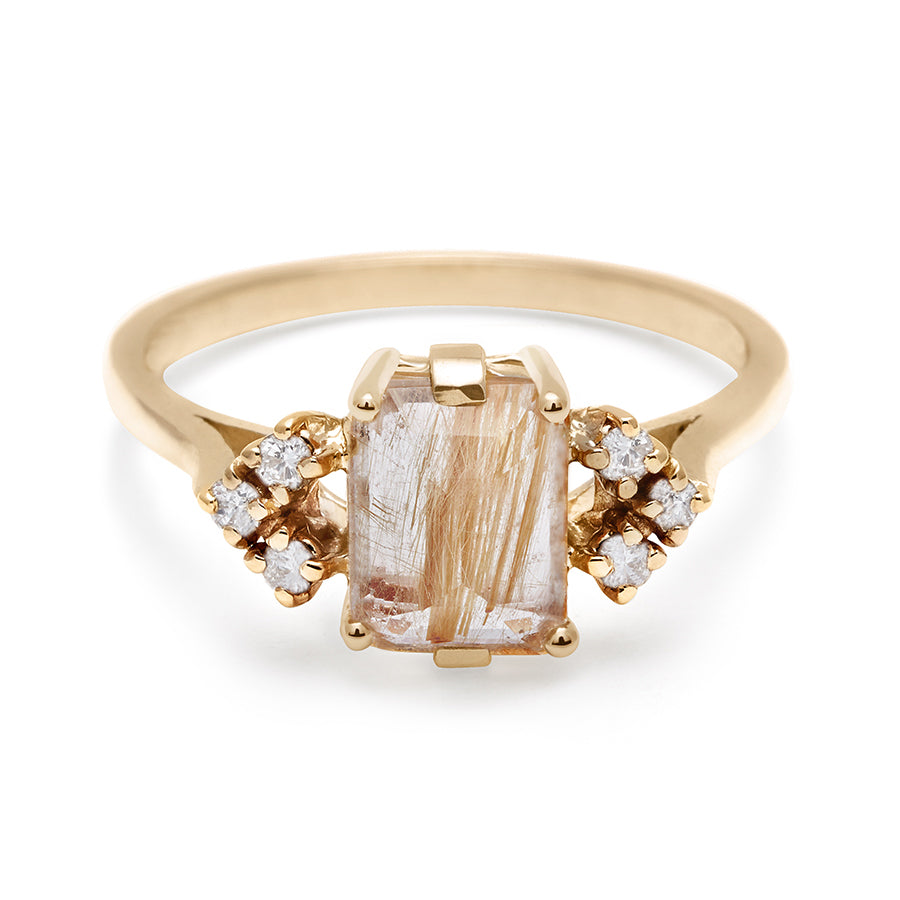 A ring with an emerald cut golden rutilated quartz center with three round white diamonds on either side in arrow shape, set in yellow gold., Yellow Gold