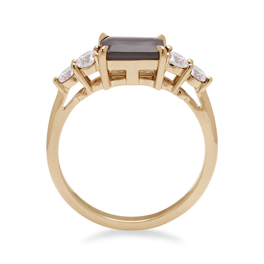 Side view of a ring with an emerald shaped grey moonstone center stone with two round white diamonds on either side set in yellow gold., Yellow Gold