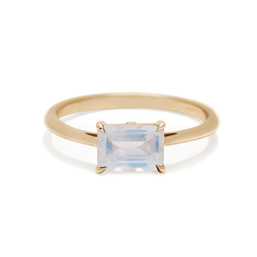 An east/west solitaire ring with an emerald shape rainbow moonstone set in yellow gold., Yellow Gold