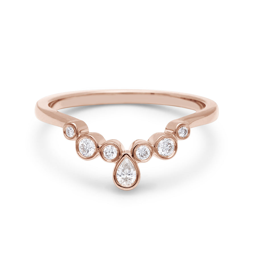 A band with bezel set white diamonds in ascending size set in rose gold., Rose Gold