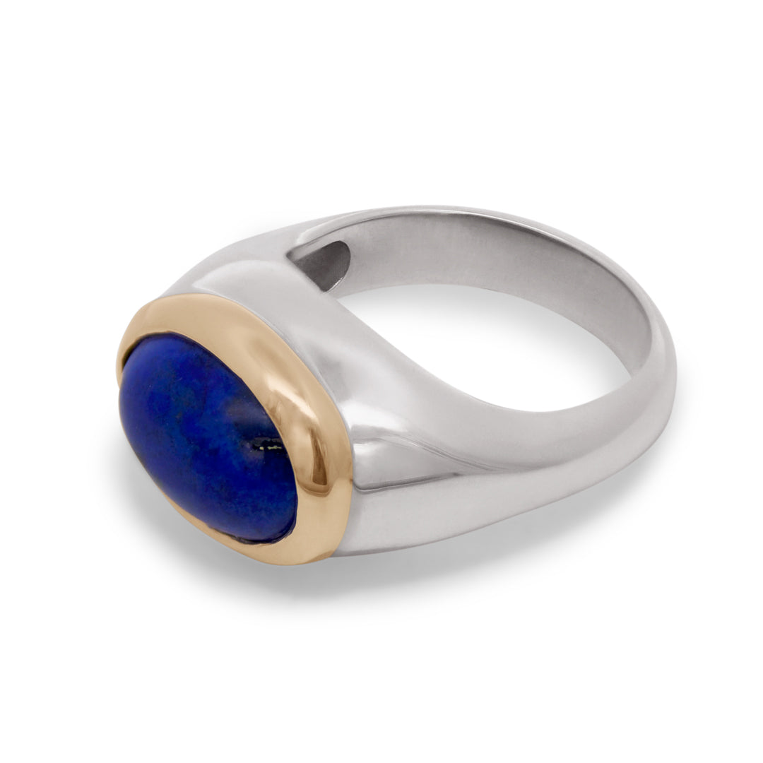 A sterling silver signet ring featuring a blue lapis stone set in a yellow gold bezel on a white background