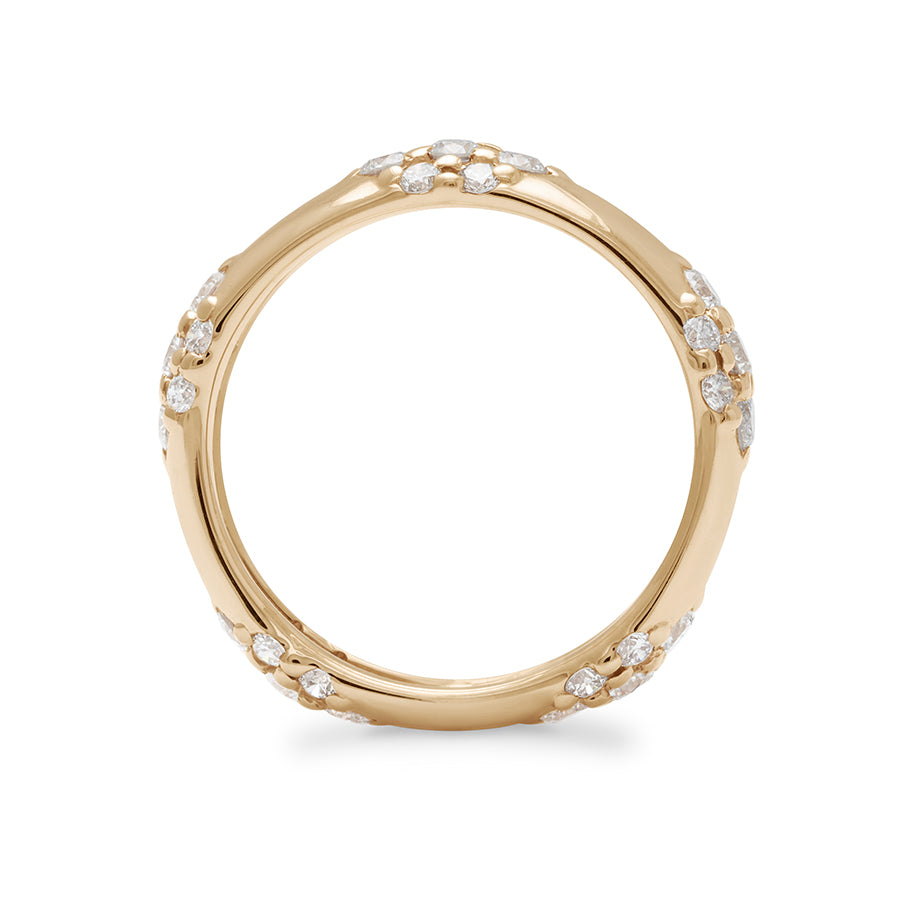 Side view of a 5mm straight band with five clusters of white diamonds set in yellow gold.