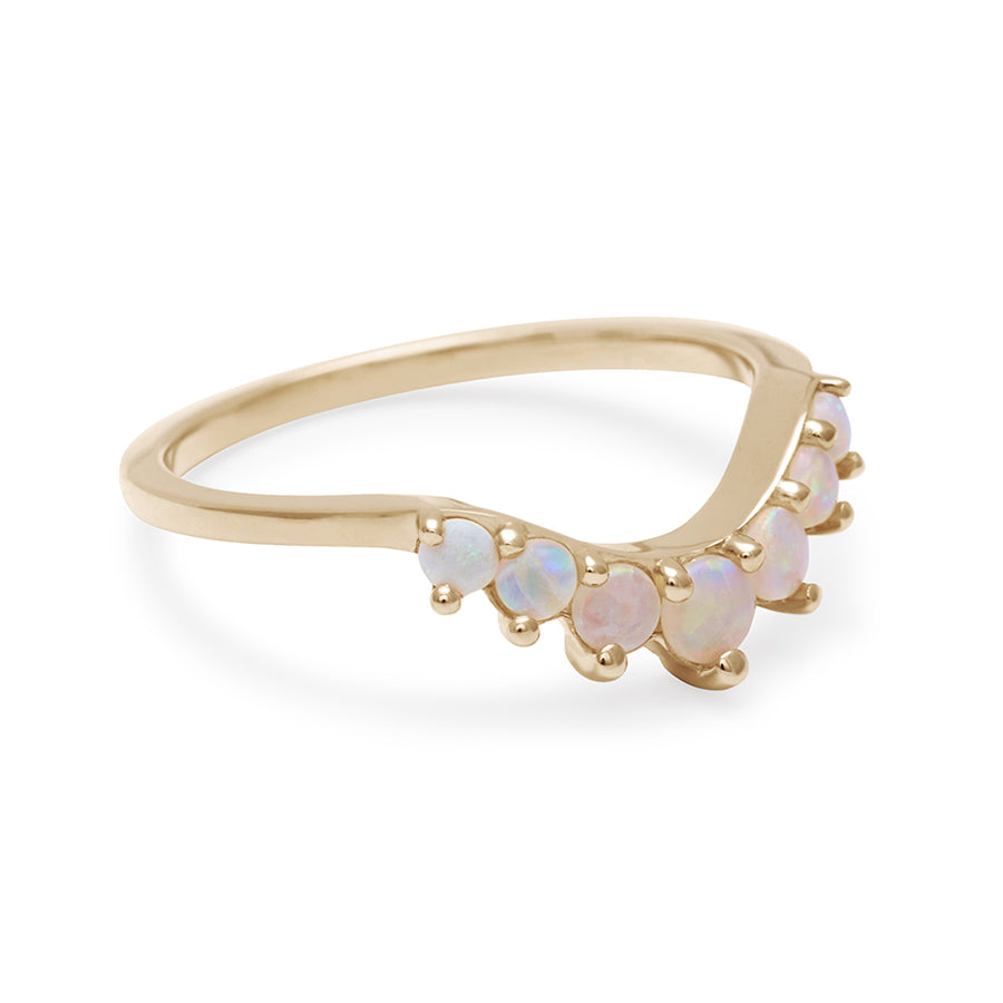 Side view of a curved 7 opal band set in yellow gold.
