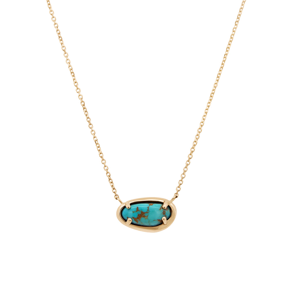 A gold chain necklace with an oval bezel setting holding a turquoise stone with dark matrix, shown on a plain white background.
