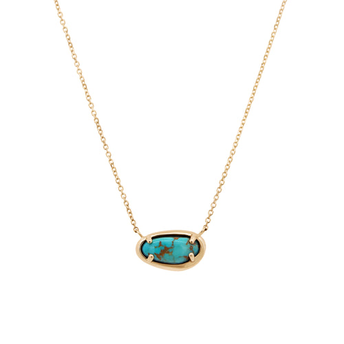 A gold chain necklace with an oval bezel setting holding a turquoise stone with dark matrix, shown on a plain white background.