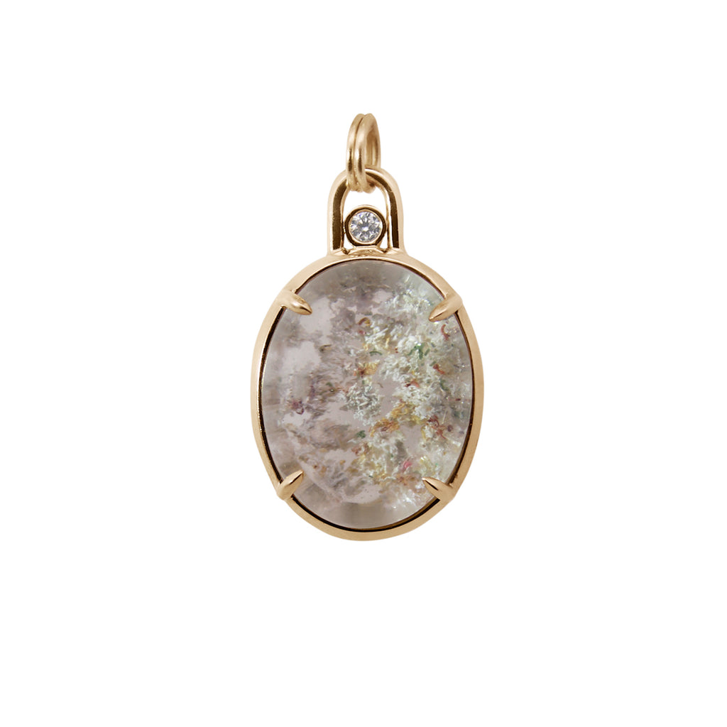 Gold pendant with a natural stone center on a white background