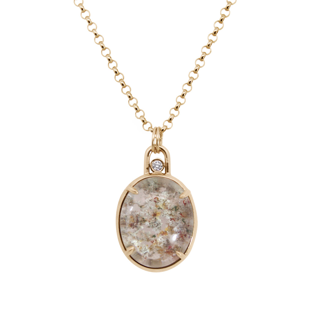 Gold necklace with a pendant featuring a natural stone design on a white background