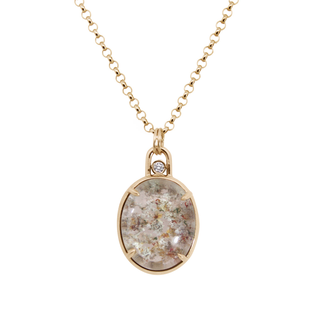Gold necklace with a pendant featuring a natural stone design on a white background