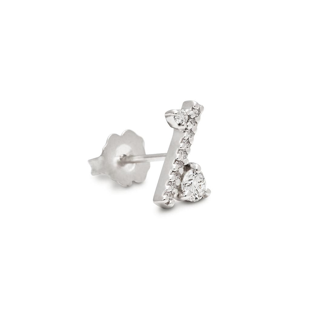 Angled view of a single earring with a straight line of white diamond pave with white diamond accent stones on either side set in a white gold.