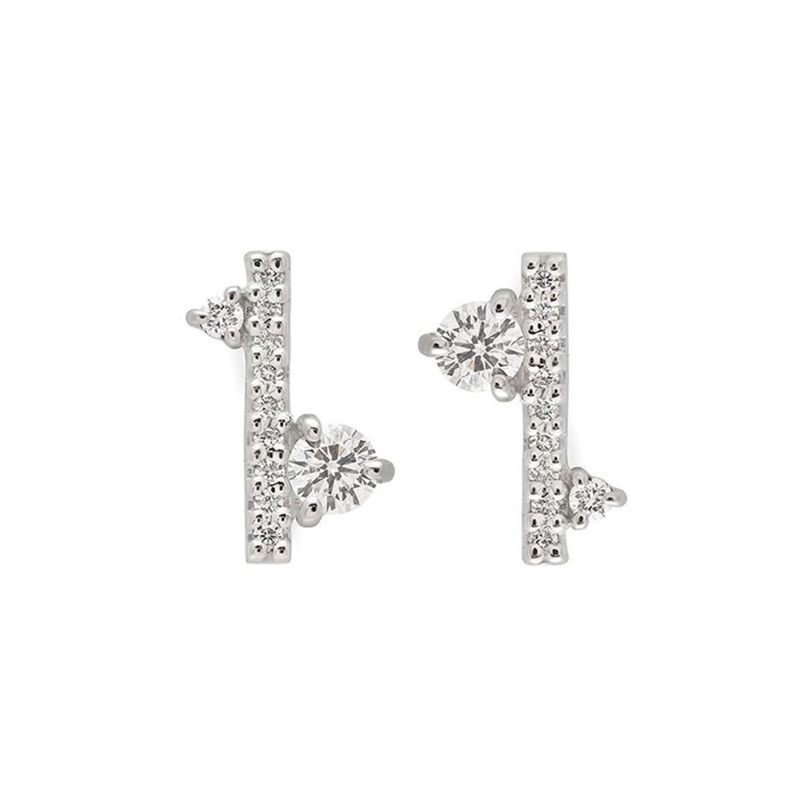 A pair of earrings with straight lines of white diamond pave with white diamond accent stones on either side set in a white gold., White Gold
