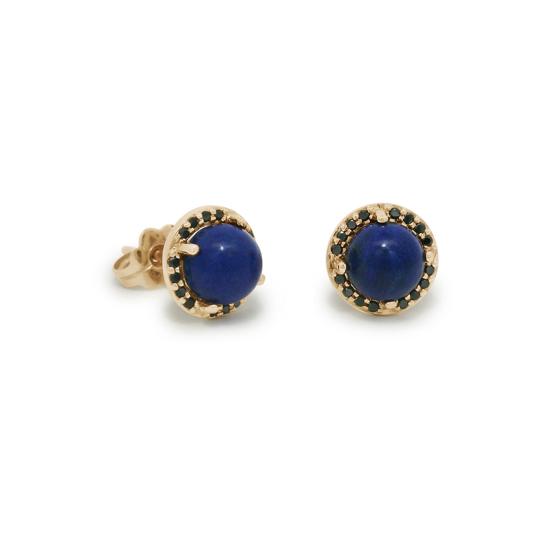 Pair of gold earrings with blue gemstones on a white background