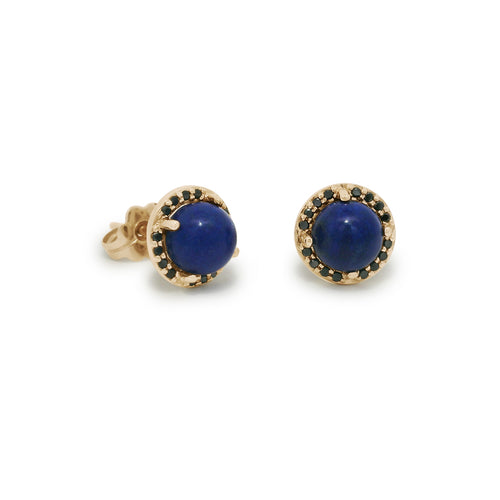 Pair of gold earrings with blue gemstones on a white background