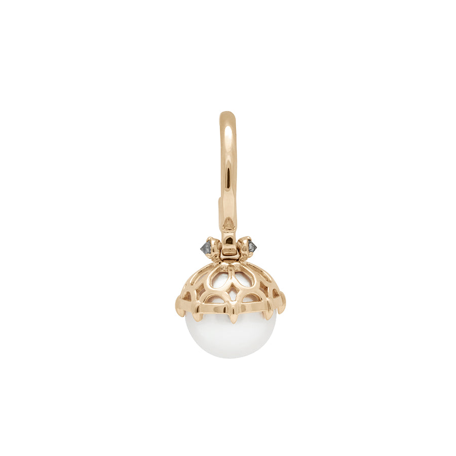 A single hoop with a white pearl hanging from it with grey diamond accents on either side set in yellow gold.