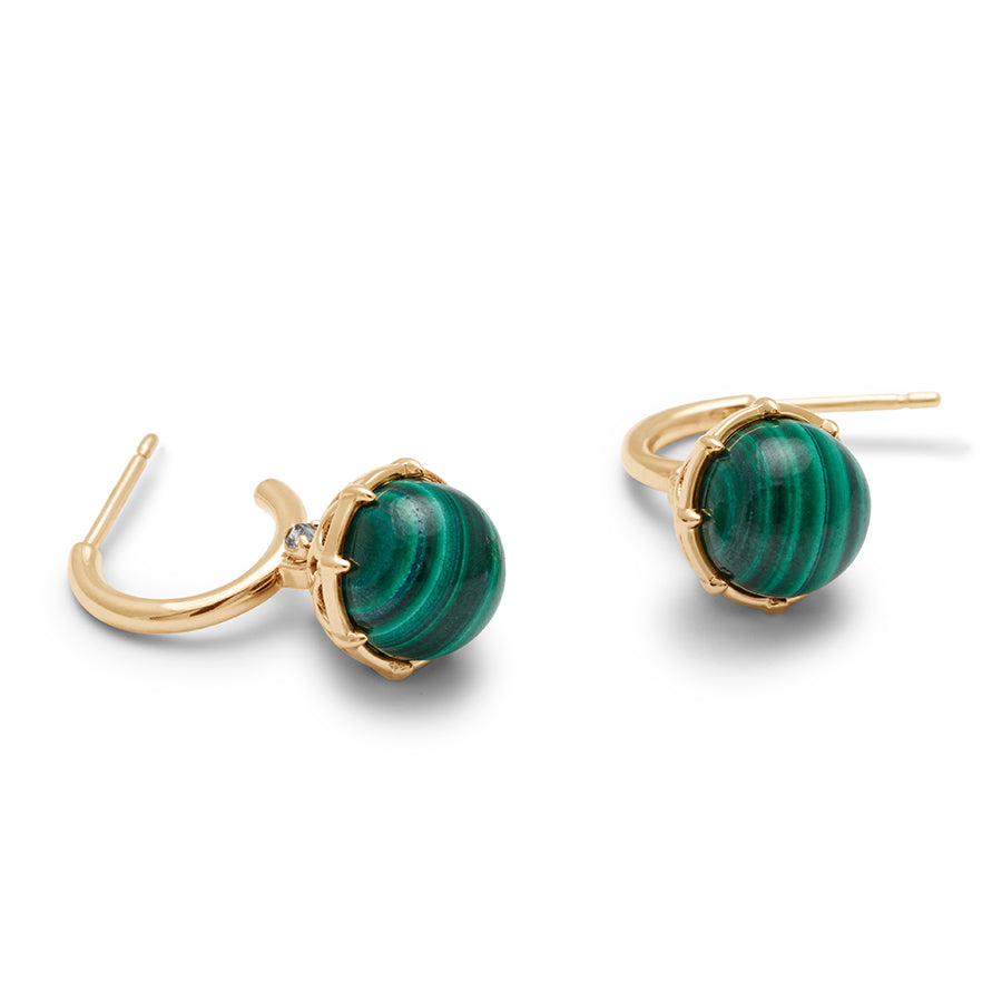 Two layed out hoops with a malachite stone hanging from it with grey diamond accents on either side set in yellow gold.