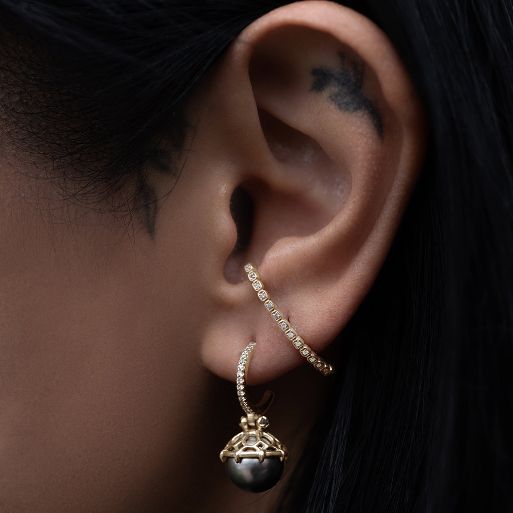 Female ear wearing Wheat Half Eternity Climber - 14k Gold & Grey Diamonds