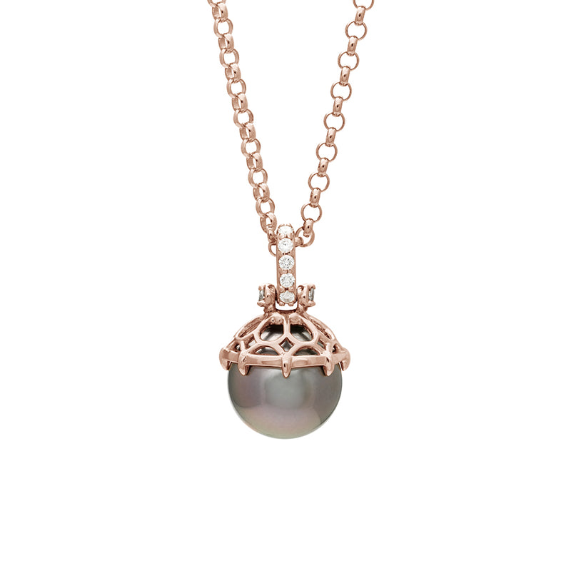 A one of a kind peacock pearl pendant with white diamond pave on the top and grey diamond accent stones on either side on a rose gold chain.