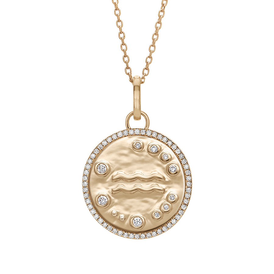A 19mm constellation charm pendant with an Aquarius sign in the center with white diamond accent stones and a white diamond halo set in yellow gold on a yellow gold chain., Aquarius
