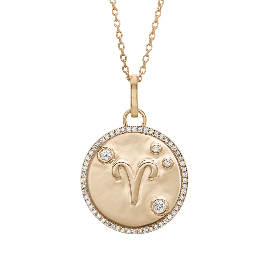 A 19mm constellation charm pendant with an Aries sign in the center with white diamond accent stones and a white diamond halo set in yellow gold on a yellow gold chain., Aries