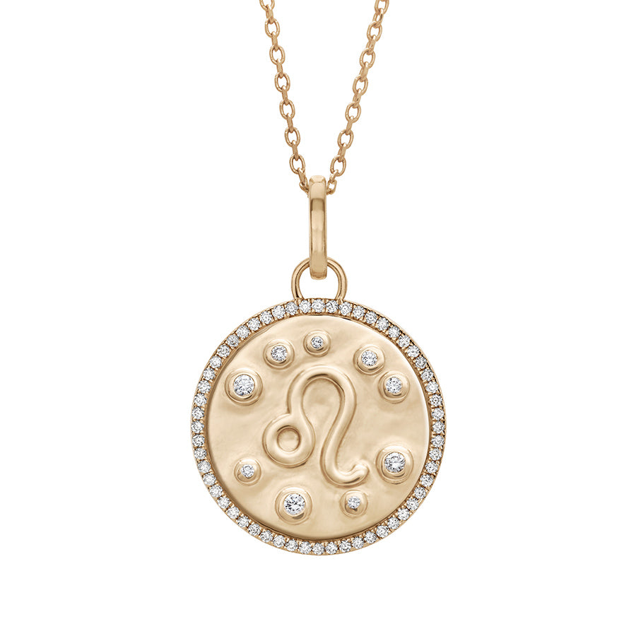 A 19mm constellation charm pendant with a Leo sign in the center with white diamond accent stones and a white diamond halo set in yellow gold on a yellow gold chain., Leo