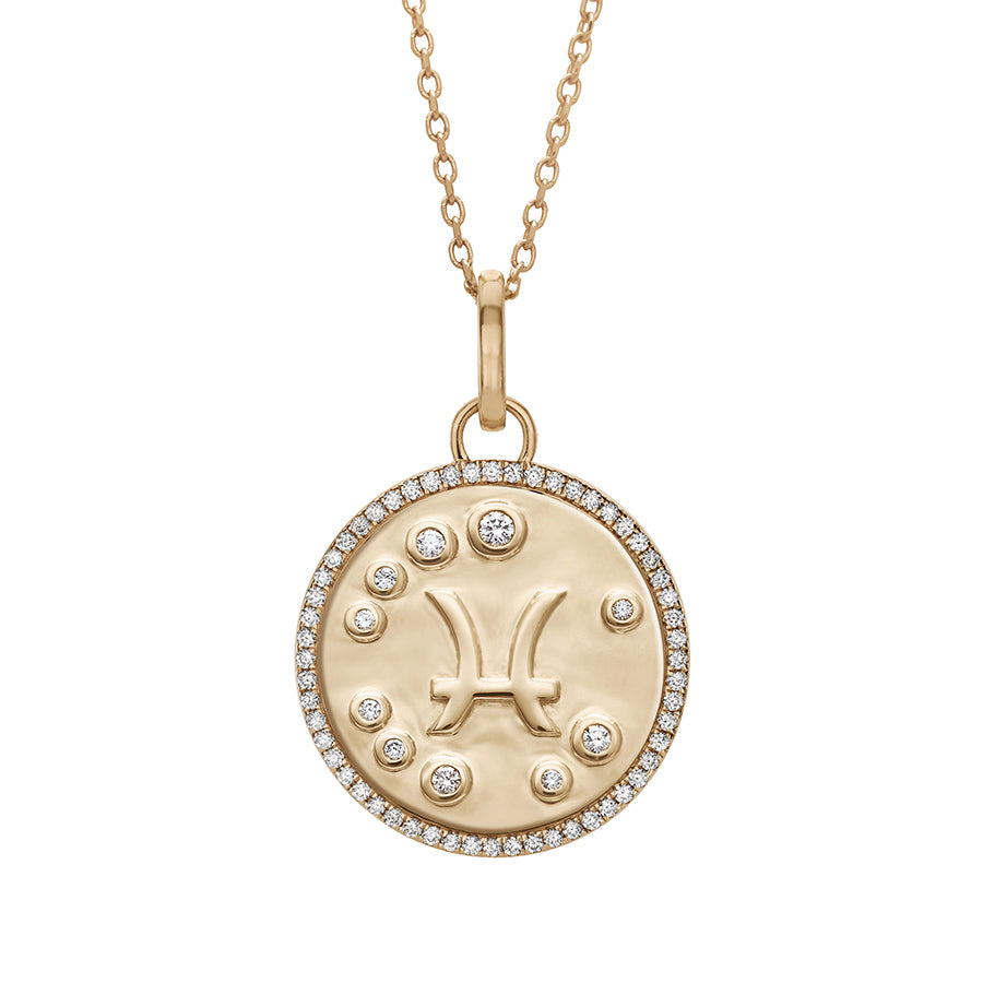 A 19mm constellation charm pendant with a Pisces sign in the center with white diamond accent stones and a white diamond halo set in yellow gold on a yellow gold chain., Pisces