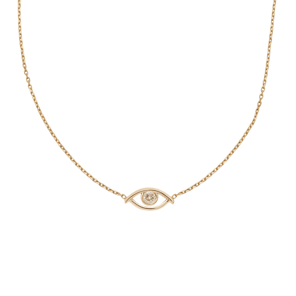 A choker with an evil eye charm with a champagne diamond in the center set on a yellow gold chain.