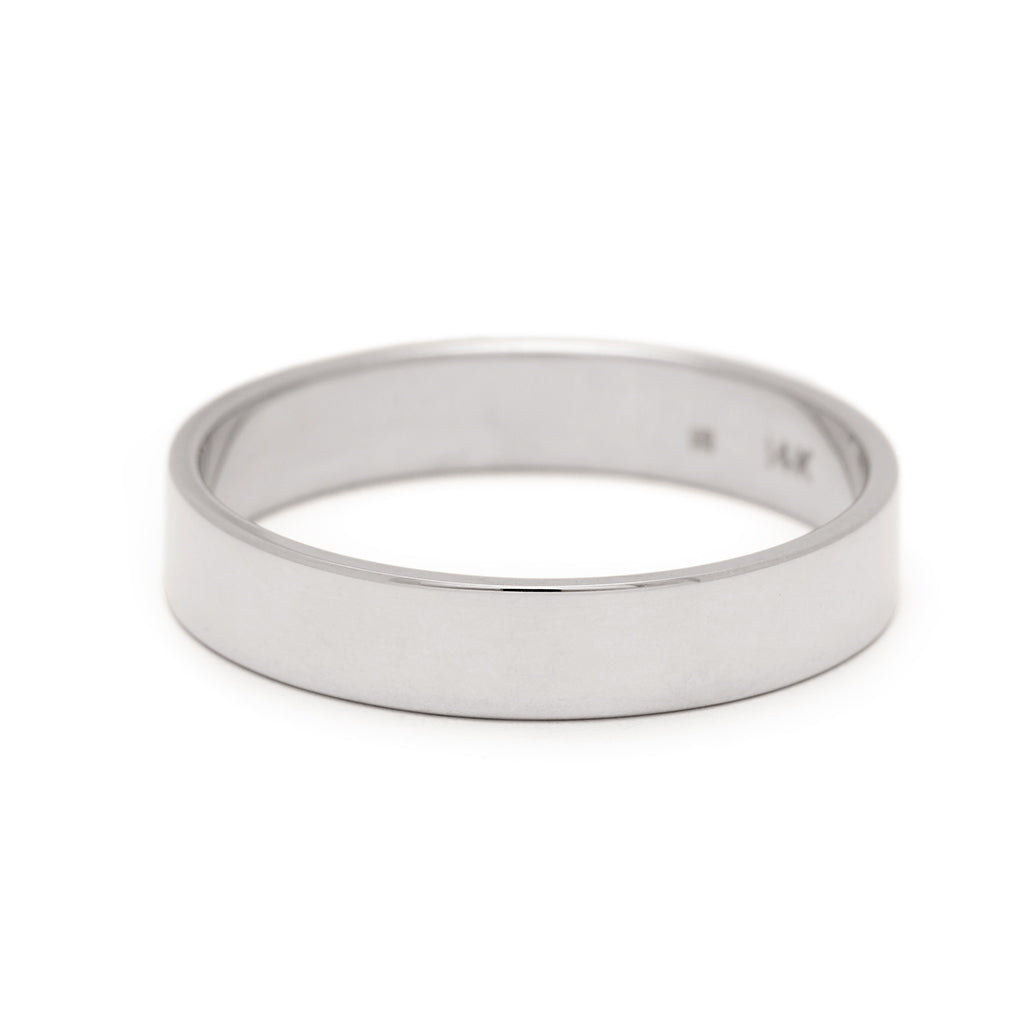 A 4mm flat band set in white gold.