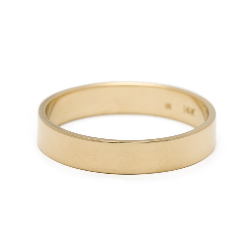 A 4mm flat band set in yellow gold., Yellow Gold