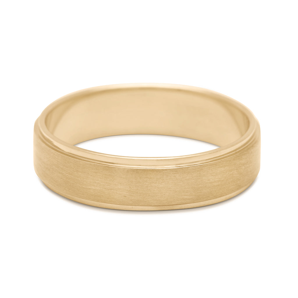 A 5mm flat edge band with a brushed finished set in yellow gold.