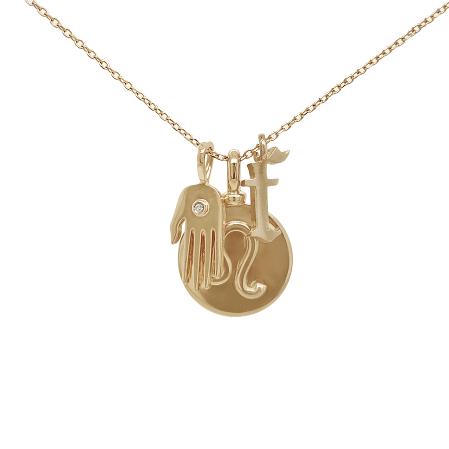 A "f" initial charm set in yellow gold on a yellow gold chain, with a leo zodiac charm and a hand charm with a white diamond accent.