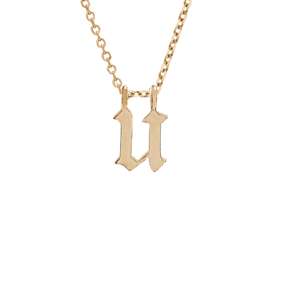 A "u" initial charm set in yellow gold on a yellow gold chain., Letter U