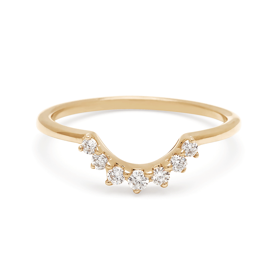 A curve band with 7 white diamonds set in yellow gold.