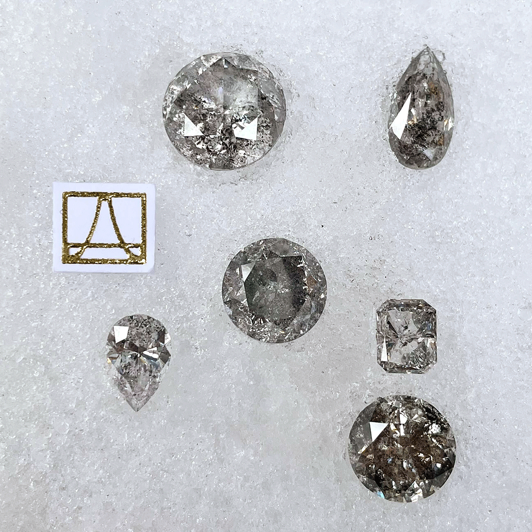 Loose grey diamonds sourced by Anna Sheffield.