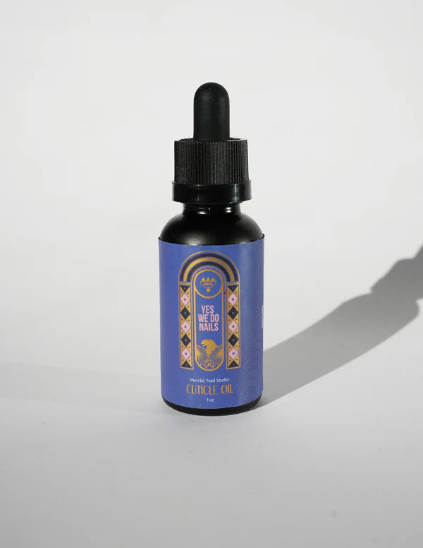 Bottle of 'Yes to the Nails' cuticle oil with a decorative label on a white background
