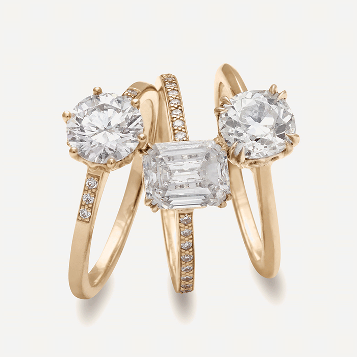 Solitaire engagement rings in 14k yellow gold with white diamonds.