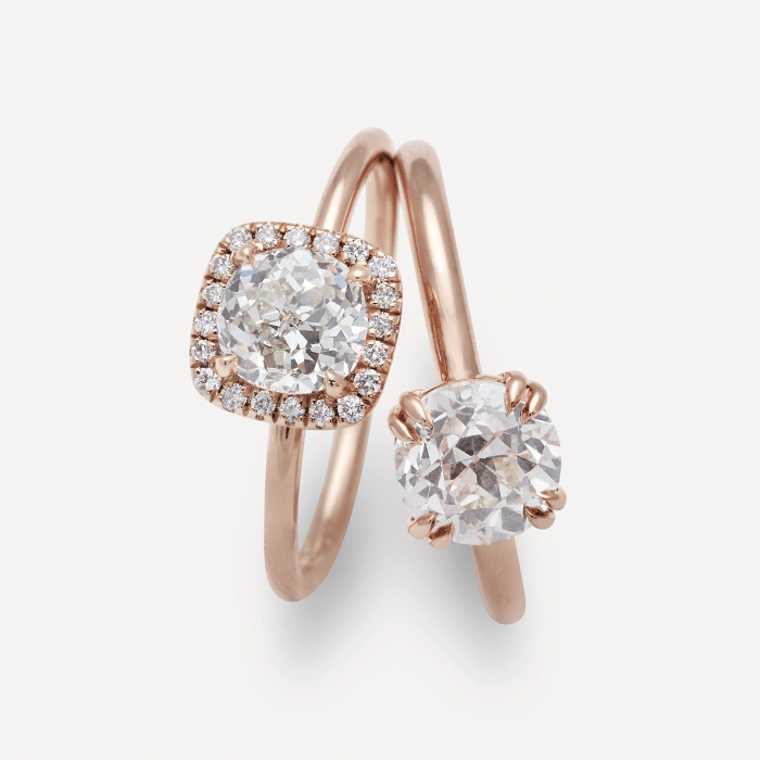 Engagement rings with earth friendly antique white diamond center stones in rose gold.