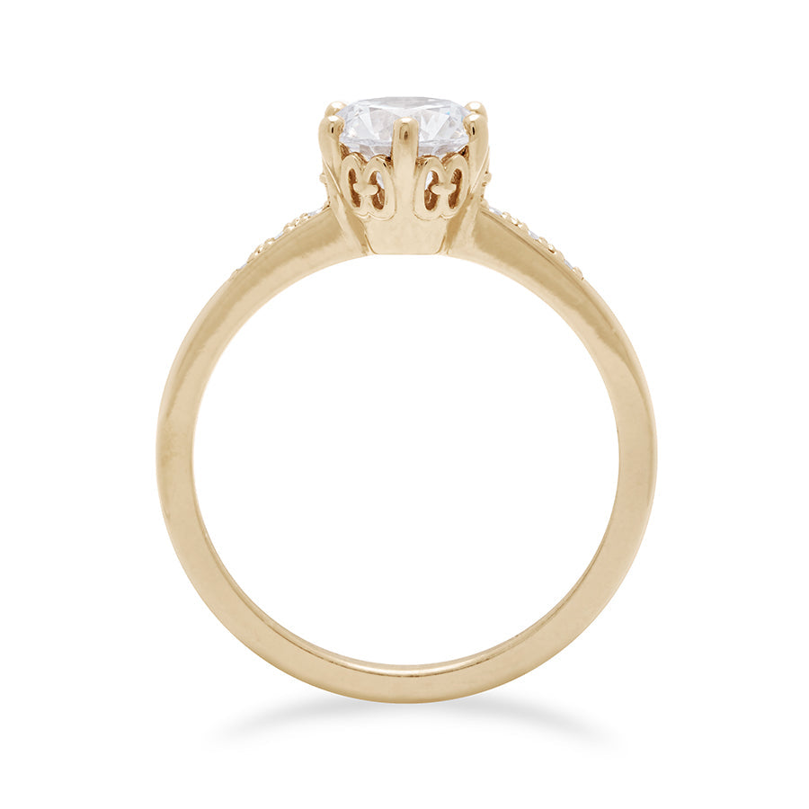 Side view of a solitaire ring with a round brilliant cut 1.00ct white diamond with white diamond pave on either side set in yellow gold., Yellow Gold
