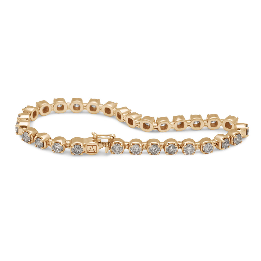 A line bracelet with grey diamonds set in eternity in yellow gold with a curve.