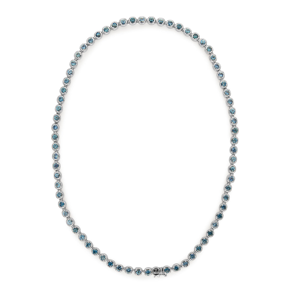 A line necklace with Montana sapphires set in eternity in white gold.