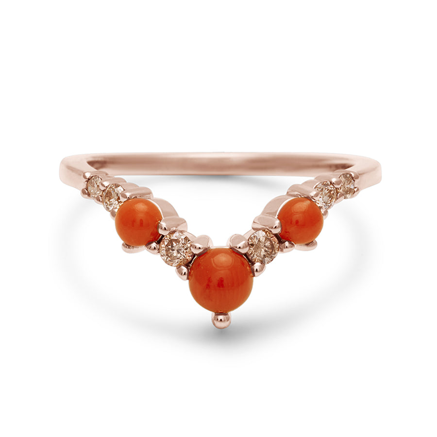 A band with three large coral stones with champagne diamonds in between set in rose gold., Rose Gold