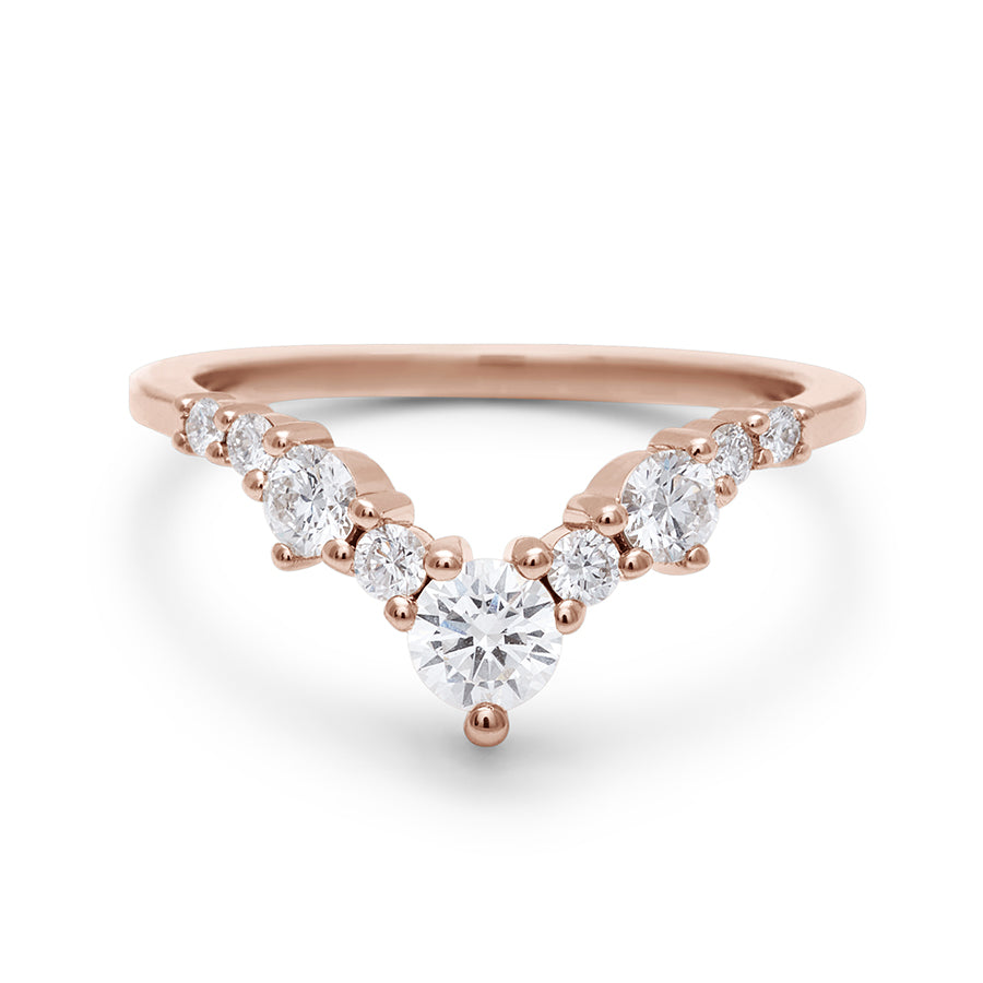 A band with large white diamonds in ascending size set in rose gold., Rose Gold