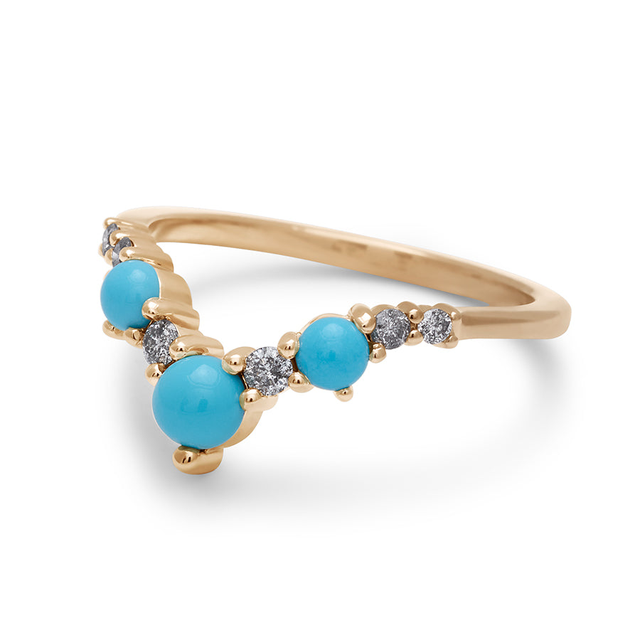 Angled view of a band with three large turquoise stones with grey diamonds in between set in yellow gold., Yellow Gold